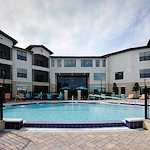 Allegro Winter Park senior living offering independent living, assisted living, memory care, and respite care in Winter Park, FL, outdoor pool with poolside seating
