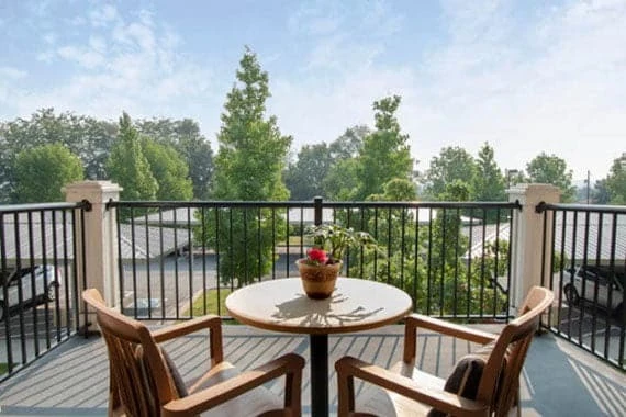 Wenatchee Senior Living by Cogir senior living community offering independent living, assisted living, and respite care in Wenatchee, WA, outdoor balcony with seating and a view