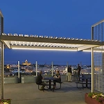 Ligutti Tower independent senior living outdoor patio with skyline view