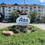 Alto Tavares, senior living community offering assisted living, memory care, and respite care in Tavares, FL, front exterior and community sign