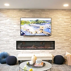 Astral at Auburn, senior living community offering independent living, assisted living, and memory care in Auburn, IN, sitting area by fireplace