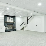 Legato Living Residential Memory Care at Indian Hills senior living community offering assisted living and memory care in Omaha, NE, open finished basement with large fireplace