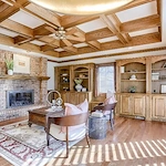 Legato Living Residential Memory Care at Rockbrook senior living community offering assisted living and memory care in Omaha, NE, cozy community sitting area featuring a fireplace and wooden built-in shelves