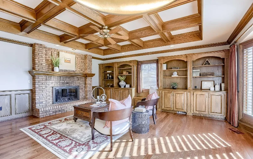 Legato Living Residential Memory Care at Rockbrook senior living community offering assisted living and memory care in Omaha, NE, cozy community sitting area featuring a fireplace and wooden built-in shelves