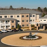 Westhill Macon senior living community offering assisted living and memory care in Macon, GA, front exterior with fountain feature