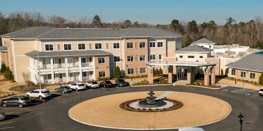 Westhill Macon senior living community offering assisted living and memory care in Macon, GA, front exterior with fountain feature