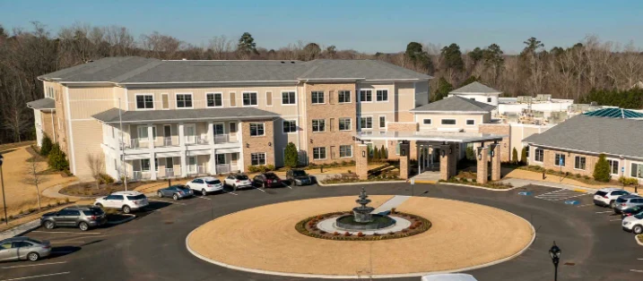 Westhill Macon senior living community offering assisted living and memory care in Macon, GA, front exterior with fountain feature