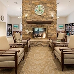 Woodbridge Terrace of Irvine, independent living, assisted living, and memory care in Irvine, CA, sitting area by fireplace