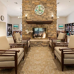 Woodbridge Terrace of Irvine, independent living, assisted living, and memory care in Irvine, CA, sitting area by fireplace