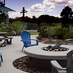 Alto Tavares, senior living community offering assisted living, memory care, and respite care in Tavares, FL, outdoor sitting area by a fire pit