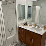 Willow Manor at Cabin Branch senior living community offering independent living and affordable living in Clarksburg, MD, apartment bathroom wiith white tiled shower