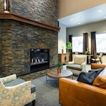 Fieldstone on Clear Creek Independent and Assisted Living sitting area by fireplace