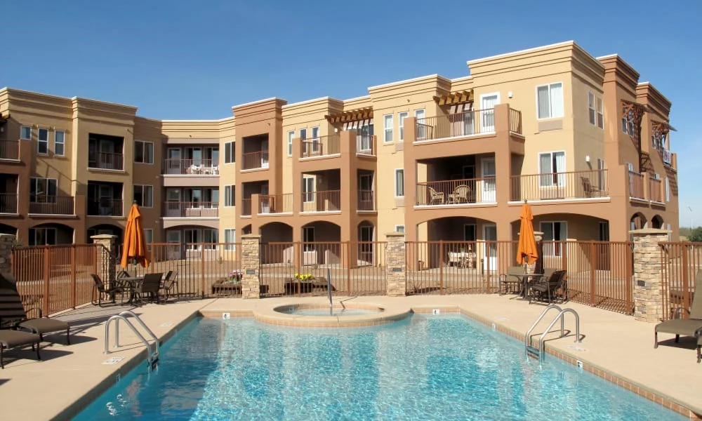 Mountain View Gardens Gracious Retirement Living Hawthorn Senior Independent Living in Sierra Vista, Arizona rear exterior with pool and hot tub