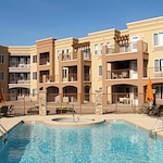 Mountain View Gardens Gracious Retirement Living Hawthorn Senior Independent Living in Sierra Vista, Arizona rear exterior with pool and hot tub