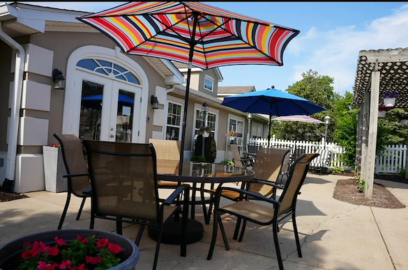 Independent living and assisted living at Beech Grove Meadows Assisted Living in Beech Grove, IN, rear exterior outdoor patio seating area