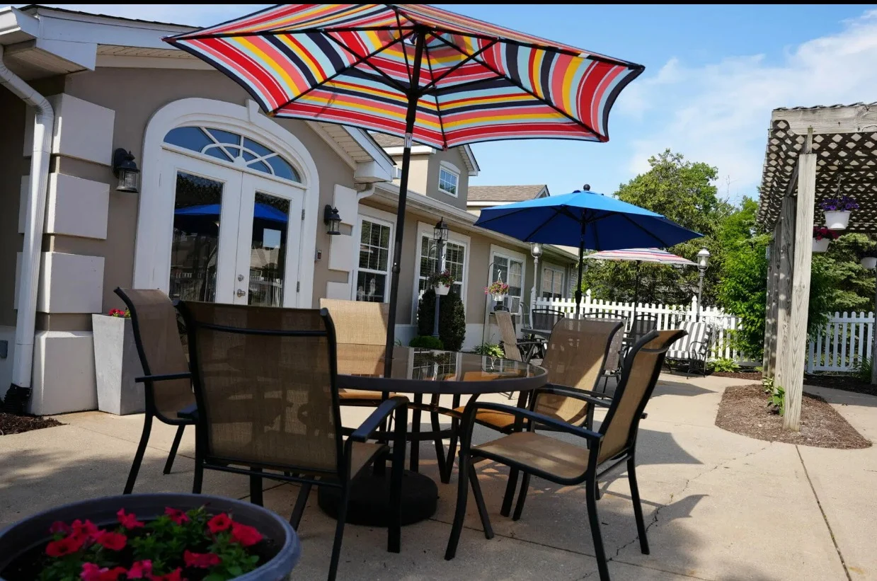Independent living and assisted living at Beech Grove Meadows Assisted Living in Beech Grove, IN, rear exterior outdoor patio seating area