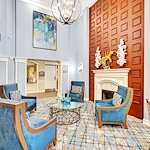 Allegro Boynton Beach, senior living community offering independent living, assisted living, memory care, and respite care in Boynton Beach, FL, common sitting area by fireplace