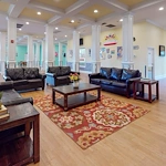 Open concept lounge area with lots of natural light at Orchard Ridge Residencies