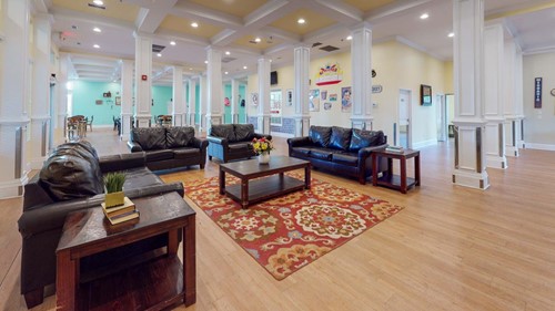 Open concept lounge area with lots of natural light at Orchard Ridge Residencies