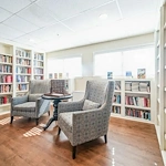 Barclay House of Tarboro senior living community offering independent living, assisted living, and memory care in Tarboro, NC, library with cozy seating