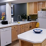 Legato Living Residential Memory Care at Legacy senior living community offering assisted living, memory care, adult day services, and respite care in Omaha, NE, community kichen with a view in the living room