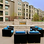 Active adult living and independent living at Watercrest at Shadow Creek Ranch in Pearland, TX, comfortable outdoor sitting area by a fireplace