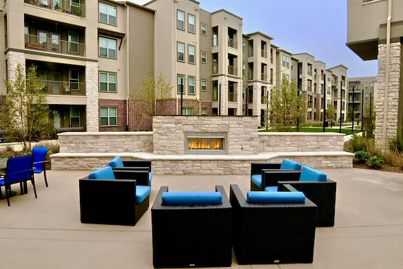 Active adult living and independent living at Watercrest at Shadow Creek Ranch in Pearland, TX, comfortable outdoor sitting area by a fireplace