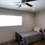 Legato Living Residential Memory Care at Old Town senior living community offering assisted living and memory care in Scottsdale, AZ, bedroom with a bed and a desk