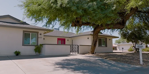 Legato Living Residential Memory Care at Old Town senior living community offering assisted living and memory care in Scottsdale, AZ, front exterior featuring a bright red front door