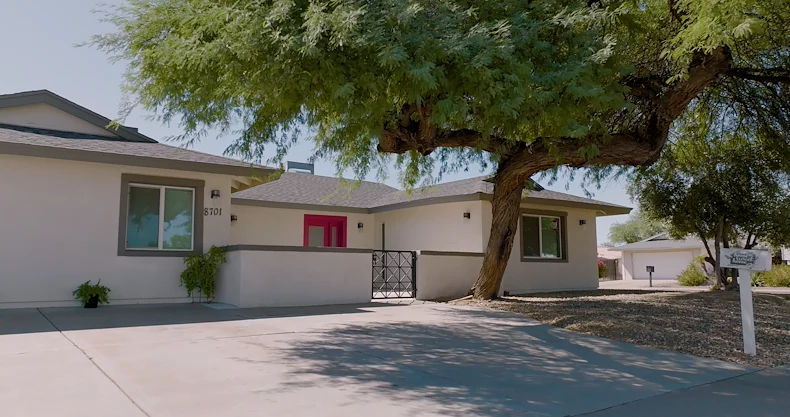 Legato Living Residential Memory Care at Old Town senior living community offering assisted living and memory care in Scottsdale, AZ, front exterior featuring a bright red front door