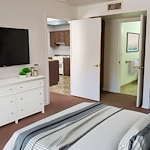Assisted Living, 1 bed/1 bath apartment. Bedroom with attached private bath (virtually staged, all apartments unfurnished)