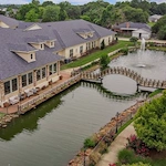 Montclair Park Assisted and Independent Senior Living in Shreveport, LA bridge over water with fountain