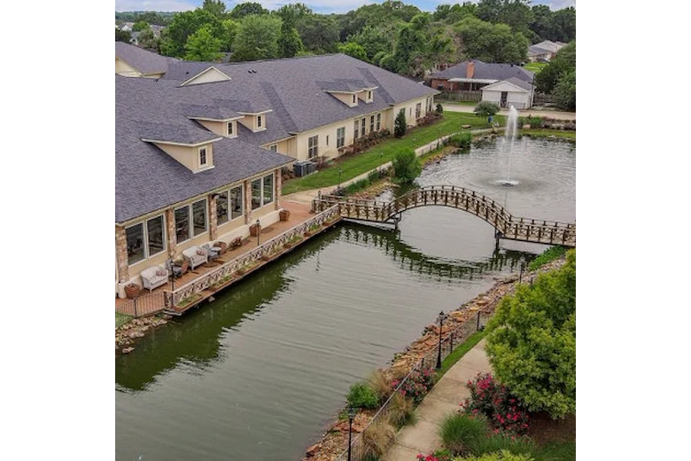 Montclair Park Assisted and Independent Senior Living in Shreveport, LA bridge over water with fountain