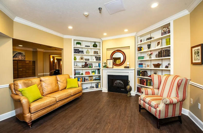 Westlake Woods by New Perspective senior living community offering assisted living in Erie, PA, lounge area by fireplace