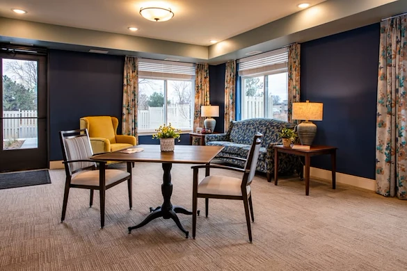 Independent living, assisted living, memory care, and respite care at Broadwell Senior Living – Plymouth in Plymouth, MN, community room with a lounging area and tables for games