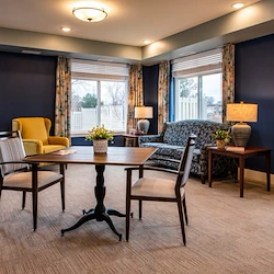Independent living, assisted living, memory care, and respite care at Broadwell Senior Living – Plymouth in Plymouth, MN, community room with a lounging area and tables for games