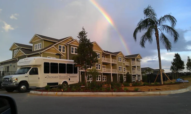 Orchard Heights Gracious Retirement Living Hawthorn Senior Independent Living in Clermont, Florida front exterior transportation bus