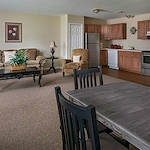 American House Dearborn Heights, senior living community offering independent living and respite care in Dearborn Heights, MI, apartment kitchen and living room