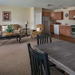 American House Dearborn Heights, senior living community offering independent living and respite care in Dearborn Heights, MI, apartment kitchen and living room