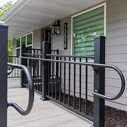 Legato Living Residential Memory Care at Heartland Hills senior living community offering assisted living, memory care, adult day services, and respite care in Bellevue, NE, entrance with a sidewalk and handrails leading to the front door