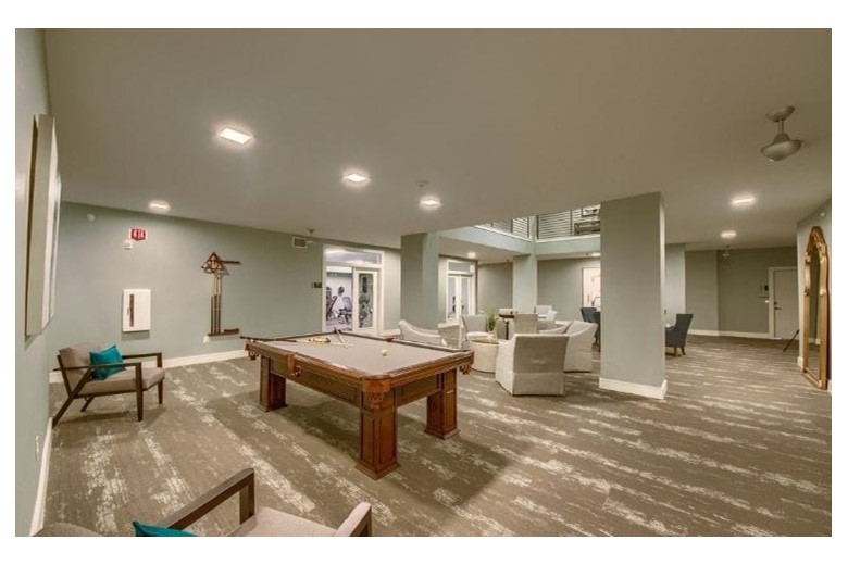 Pool table and game room at Verena at Leander Senior Living