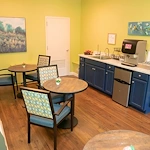 Wesley Manor Assisted Living Community offering assisted living and continuing care retirement community (CCRC) services in Louisville, KY, coffee station for residents as well as tables and chairs