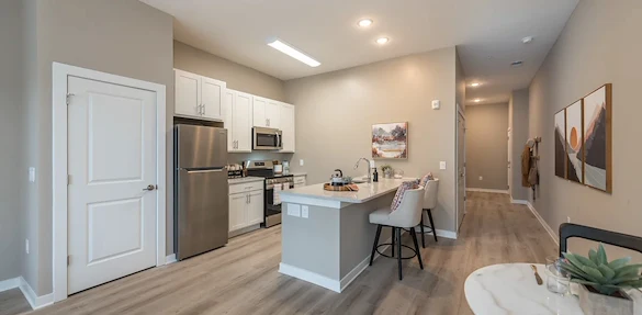 Acclaim at Cary Pointe, senior living community offering active adult and independent living in Cary, NC, apartment kitchen with stainless-steel appliances