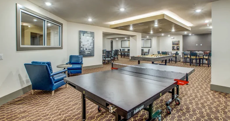 Watermere at Woodland Lakes senior living community offering active adult living and independent living in Conroe, TX, activities room with table tennis and a pool table