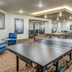 Watermere at Woodland Lakes senior living community offering active adult living and independent living in Conroe, TX, activities room with table tennis and a pool table