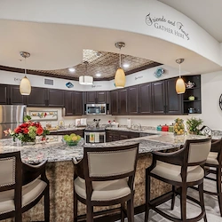 Wilshire Estates Gracious Retirement Living, independent living in Silver Spring, MD, community kitchen with countertop and barstool seating