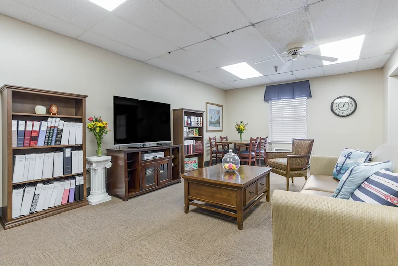 Charter Senior Living of Bowling Green common area with seating and a tv