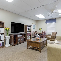 Charter Senior Living of Bowling Green common area with seating and a tv