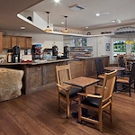 Alto Clermont, senior living community offering assisted living, memory care, and respite care in Clermont, FL, café-style dining area with coffee bar and snacks