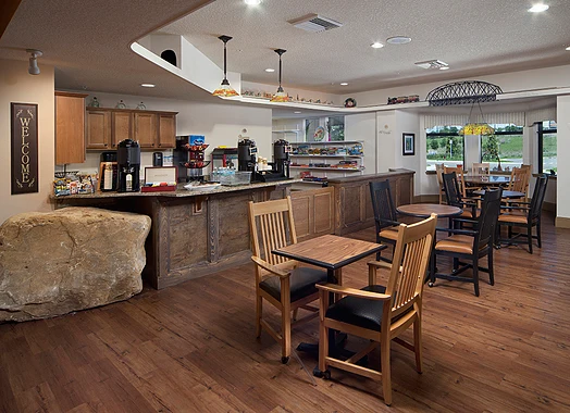 Alto Clermont, senior living community offering assisted living, memory care, and respite care in Clermont, FL, café-style dining area with coffee bar and snacks